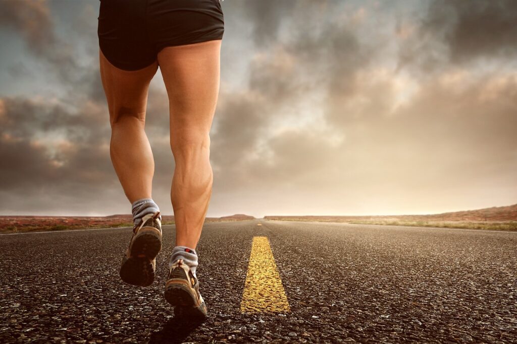 A photo of a runner's legs on a road